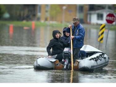 Water levels in Gatineau have started to come down in the flooding but major damage is starting to show Saturday May 13, 2017. L-R Stephanie Charron and Lorraine Girard get a ride out to check the status of their home Saturday.