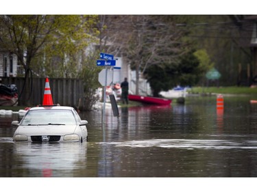 Water levels in Gatineau have started to come down in the flooding but major damage is starting to show Saturday May 13, 2017. A car that at one point was almost fully covered is still sitting on Rue Saint-Louis with the pylon on the roof.