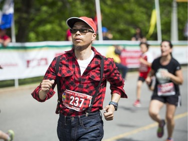 Winston Mei near the finish line of the 2K race at Tamarack Ottawa Race Weekend. Mei was taking part in the lumberjack challenge, running the 2K, 5K, 10K and full marathon.