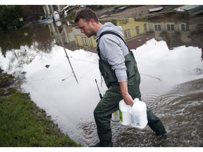 Yann Jodoin heads to his rental property on boulevard Hurtubise with jugs of anti-fungal cleaners.