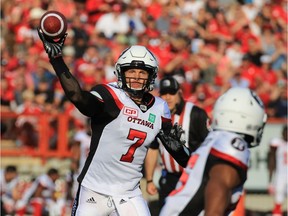 Redblacks quarterback Trevor Harris throws a pass during the first half during of CFL action against the Stampeders on Thursday night. Gavin Young/Postmedia