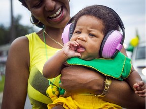 Five-month-old Maliah Aird had the perfect headphones to protect her little ears from the loud music, but was still having a blast with all the sights and sounds as the Carivibe Street Parade had people dancing to Caribbean music down St. Joseph Blvd in Orleans June 17, 2017.