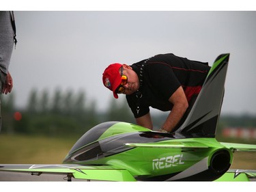 Pilots, spotters and spectators were at the Carp Airport to enjoy the miniature radio-controlled jet planes taking flight Saturday June 17, 2017. Elckar Monsalve gets the Rebel Pro ready for flight.   Ashley Fraser/Postmedia
Ashley Fraser, Postmedia