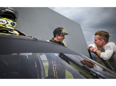 For the first time ever the Red Bull Global Rallycross made a Canadian stop over the weekend at the Canada Aviation and Space Museum. L-R Tanner Foust with the Volkswagen Andretti Rallycross team chats with Patrik Sandell of the Subaru Rally Team USA before hitting the track Sunday June 18, 2017.   Ashley Fraser/Postmedia
Ashley Fraser, Postmedia