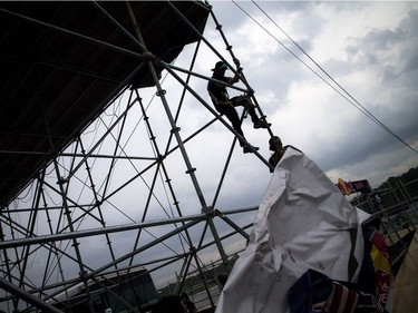For the first time ever the Red Bull Global Rallycross made a Canadian stop over the weekend at the Canada Aviation and Space Museum. Strong winds and a short burst of heavy rain moved in and had crews quickly pulling down the sides of the tower that had Red Bull signage Sunday June 18, 2017.   Ashley Fraser/Postmedia
Ashley Fraser, Postmedia