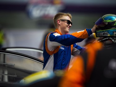 For the first time ever the Red Bull Global Rallycross made a Canadian stop over the weekend at the Canada Aviation and Space Museum. Cabot Bigham racing for Bryan Herta Rallysport in a Ford Fiesta ST picks up his helmet off his car before he head out to the track Sunday June 18, 2017.   Ashley Fraser/Postmedia
Ashley Fraser, Postmedia