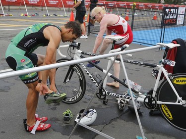 David Blair, right, winner of the visually impaired paratriathlon, takes part in the Ottawa International Triathlon in Ottawa on Sunday, June 18, 2017.