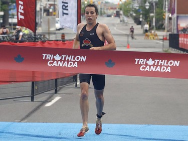 Gabriel Legault wins the age group sprint distance exhibition final triathlon at the Ottawa International Triathlon in Ottawa on Sunday, June 18, 2017.