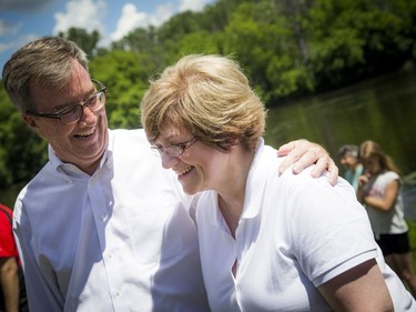 The Royal Swans, two Australian Black and two Mute White, were released into the Rideau River during a family event at Brantwood Park Saturday June 24, 2017. Mayor Jim Watson laughs with the swan keeper Christine Hartig during the speeches.