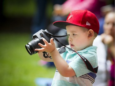 His Excellency the Right Honourable David Johnston, Governor General and Commander-in-Chief of Canada host  the annual Inspection of the Ceremonial Guard and the launch of Storytime on Sunday, June 25, 2017, at Rideau Hall. Three-year-old William Barker was busy learning the ropes of being a photographer during Storytime Sunday.   Ashley Fraser/Postmedia
Ashley Fraser, Postmedia