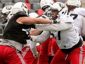 Offensive lineman Eric Lofton (#57, right) during practice. Ottawa Redblacks training camp at TD Place Monday June 5, 2017.