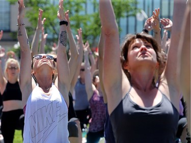 Despite construction for Canada Day all over the front lawn of Parliament, Yoga on the Hill still drew about 3,000 enthusiasts of all ages, shapes and sizes to stretch, breathe and bend.