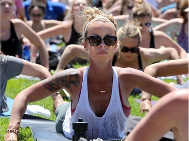 Despite construction for Canada Day all over the front lawn of Parliament, Yoga on the Hill still drew about 3,000 enthusiasts of all ages, shapes and sizes to stretch, breathe and bend Wednesday