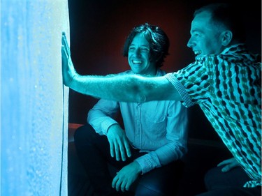 Etienne Paquette (left), the creator of the multimedia ice exhibit, gets a laugh as his friend, Louis Richard Tremblay, tries to keep his hand on the ice for a long time.  The media got a sneak peek at the Canadian Museum of Nature's new permanent Canada Goose Arctic Gallery Tuesday (June 20, 2017). The 8,000 foot space -  filled with over 200 specimens and artifacts, including a rotating Indigenous gallery and huge moving ice display -  is the museum's Canada 150 legacy project that will open to the public Wednesday (June 21, 2017). Julie Oliver/Postmedia
Julie Oliver, Postmedia
