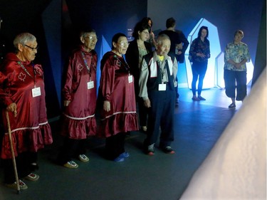 The elders from Cambridge Bay take in the multimedia ice exhibit at the Canadian Museum of Nature's new permanent Canada Goose Arctic Gallery.