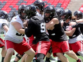 Ottawa Redblacks defensive line (black) during practice at TD Place Wednesday (June 21, 2017).