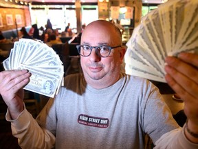 Elgin Street diner owner Ron Shrybman will celebrate Canada Day by  giving out the crisp dollar bills to 300 customers who eat at his diner, after 9 a.m. on Canada Day.