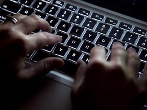 A woman uses her computer keyboard to type while surfing the internet in North Vancouver, B.C., on Wednesday, December, 19, 2012. Federal officials have advised Public Safety Minister Ralph Goodale to put the brakes on setting up a publicly accessible database of high-risk child sex offenders. The previous Conservative government ushered in legislation that opened the door to allowing the RCMP to create such a database as part of measures to crack down on child predators.THE CANADIAN PRESS/Jonat