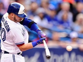 Toronto Blue Jays third baseman Josh Donaldson (20) hits a solo home run against the New York Yankees during first inning MLB American League baseball action in Toronto, Friday, June 2, 2017. THE CANADIAN PRESS/Frank Gunn