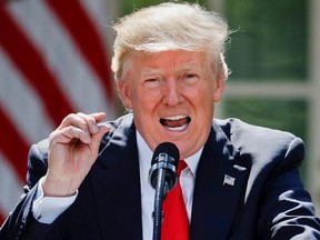 President Donald Trump gestures while speaking about the U.S. role in the Paris climate change accord, Thursday, June 1, 2017, in the Rose Garden of the White House in Washington. (AP Photo/Pablo Martinez Monsivais)