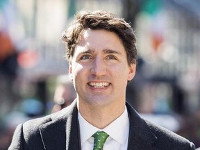 Prime Minister Justin Trudeau smiles as he participates in the annual St. Patrick&#039;s Day parade in Montreal, Sunday, March 19, 2017. Prime Minister Justin Trudeau can expect a mix of personal and political talk when he sits down with morning show co-hosts Kelly Ripa and Ryan Seacrest during their visit to Canada. THE CANADIAN PRESS/Graham Hughes