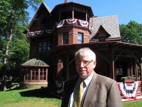 In this Thursday, June 1, 2017 photo, Pieter Roos, the new executive director of the Mark Twain House & Museum, poses outside the landmark in Hartford, Conn. Roos starts his new job July 5 after 18 years as executive director of Newport Restoration Foundation in Rhode Island.