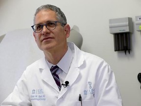 Dr. Ethan Basch speaks during an interview at the North Carolina Cancer Hospital in Chapel Hill, N.C., on Thursday, May 25, 2017. Basch conducted a study that shows cancer patients who use home computers to report problems like nausea and fatigue improved survival _ by nearly half a year, longer than many new cancer drugs do. (AP Photo/Gerry Broome)