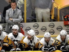 Pittsburgh Penguins head coach Mike Sullivan watches along with his players during the final minutes of the third period in Game 4 of the NHL hockey Stanley Cup Finals against the Nashville Predators Monday, June 5, 2017, in Nashville, Tenn. The Predators won 4-1 to tie the series 2-2.