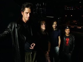 FILE - In this May 1, 2005, file photo, Audioslave band members Chris Cornell, left to right, Tim Commerford, Brad Wilk and Tom Morello pose before the start of their performance at the 9:30 Club in Washington, D.C. Cornell&#039;s former Audioslave bandmates paid tribute to the late singer by performing Audioslave&#039;s &ampquot;Like a Stone&ampquot; with a spotlight trained on an empty microphone on June 7, 2017, during a show in Berlin. (AP Photo/Manuel Balce Ceneta, File)