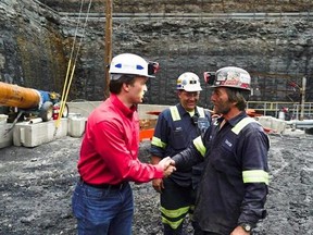 George Dethlefsen, left, CEO of Corsa Coal, speaks with a miner in a coal pit in Friedens, Pa., Wednesday, June 7, 2017. Corsa Coal Corp. says the mine will create 70 to 100 new jobs and produce some 400,000 tons of metallurgical coal a year. President Donald Trump referred to the mine&#039;s opening during a speech announcing his intent to withdraw from the Paris climate accords. (AP Photo/Dake Kang)