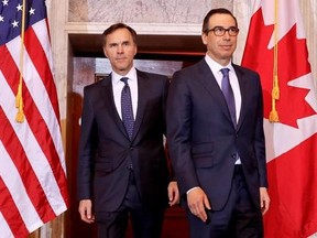 Treasury Secretary Steven Mnuchin walks with Canadian Finance Minister William F. Morneau before their bilateral meeting at the Treasury Department in Washington on March 1, 2017. Federal Finance Minister Bill Morneau will discuss trade, taxes and infrastructure when he meets Friday in Ottawa with U.S. Treasury Secretary Steve Mnuchin. In his first visit to Ottawa, Mnuchin will also meet with cabinet ministers and government officials, and take part in roundtable meetings with the Business Counc