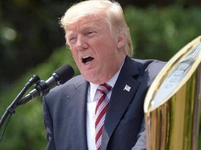 President Donald Trump speaks on the South Lawn of the White House in Washington, Monday, June 12, 2017, during a ceremony honoring the 2016 NCAA Football National Champions Clemson University Tigers.