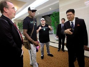 Former NBA basketball star Dennis Rodman, center, is greeted by North Korea&#039;s Sports Ministry Vice Minister Son Kwang Ho, right, upon his arrival at Sunan International Airport on Tuesday, June 13, 2017, in Pyongyang, North Korea. Rodman has arrived in North Korea on his first visit since President Donald Trump took office. (AP Photo/Kim Kwang Hyon)