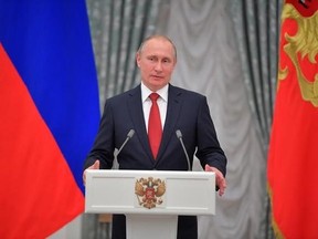 Russian President Vladimir Putin speaks during a ceremony of receiving passports by ten young Russians in Moscow&#039;s Kremlin, Russia, Monday, June 12, 2017. (Alexei Druzhinin/Sputnik, Kremlin Pool Photo via AP)