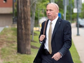 RCMP Commissioner Bob Paulson arrives to testify at the RCMP&#039;s trial on violating four charges of the Canada Labour Code in Moncton, N.B. on Thursday, June 15, 2017. The charges are related to the June 2014 shooting spree that claimed the lives of three officers. THE CANADIAN PRESS/Andrew Vaughan
