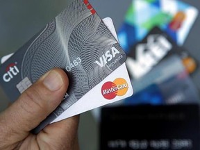 In this June 15, 2017, photo, credit cards are displayed in Haverhill, Mass. Learning that your friend has better credit than you do can be a bummer, but there are ways to improve your credit. (AP Photo/Elise Amendola)