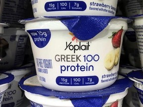 FILE - This Thursday, Feb. 23, 2017, file photo shows Yoplait Greek yogurt on display at a supermarket in Port Chester, N.Y. There‚Äôs Greek yogurt, Icelandic yogurt and Australian yogurt. Now, the U.S. maker of Yoplait says it want to bring even more culture to the dairy case. General Mills is hoping a new line of French-style yogurt can help boost its sales. Its Oui line will add to the growing variety in the yogurt case. (AP Photo/Donald King, File)