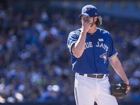 Toronto Blue Jays relief pitcher Jason Grilli reacts as he stands on the mound during eighth inning American League MLB baseball action against the New York Yankees in Toronto on June 3, 2017. The Blue Jays traded the veteran reliever to the Texas Rangers on Sunday.