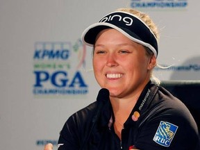 Brooke Henderson smiles as she fields questions from reporters during the practice round of the Women&#039;s PGA Championship golf tournament at Olympia Fields Country Club, Wednesday, June 28, 2017, in Olympia Fields, Ill. (AP Photo/Charles Rex Arbogast)