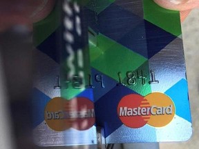 In this June 15, 2017, photo, a customer inserts a credit card to pay for parking in Haverhill, Mass. One indicator that your debt is a problem is if your credit card balances keep rising. It‚Äôs best to pay credit cards in full every month. Next best is paying enough to whittle down balances over time. If your balances are growing, your financial worries are, too. (AP Photo/Elise Amendola)