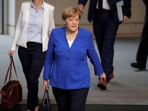 German Chancellor Angela Merkel arrives for a debate of the German parliament Bundestag on the gay marriage in Berlin, Germany, Friday, June 30, 2017. (AP Photo/Markus Schreiber)