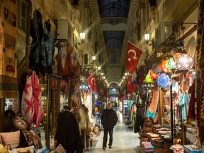 A man shops on a street behind Istanbul's famous Istiklal shopping street on November 24, 2016 in Istanbul, Turkey. Chris Kilford writes on how Turkey is damaging its international reputation.