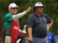 Kirk Triplett gets direction from his caddy on the third hole during Friday's first round of the 2017 U.S. Senior Open Championship at Salem Country Club in Peabody, Massachusetts. Triplett leads after shooting an 8-under-par 62. Drew Hallowell/Getty Images