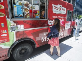 A customer orders food from the Rico Peru Food Truck on Kent Street on Thursday June 8, 2017.