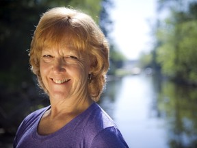 Olympian Sue Holloway has spent her life surrounded by water. But nowhere feels more like home than paddling on the Rideau River. Holloway was photographed around her home on the Rideau River Wednesday May 21, 2014.   (Ashley Fraser / Ottawa Citizen Style)

114641
Ashley Fraser, The Ottawa Citizen