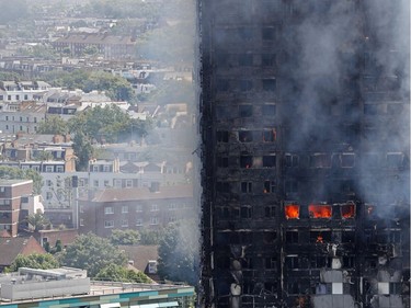 Flames and smoke engulf Grenfell Tower, a residential block of flats in west London on June 14, 2017, as firefighters continue to control a fire that started in the flats in the early hours of the morning. At least six people were killed Wednesday when a massive fire tore through a London apartment block in the middle of the night, with witnesses reporting terrified people had leapt from the 24-storey tower.