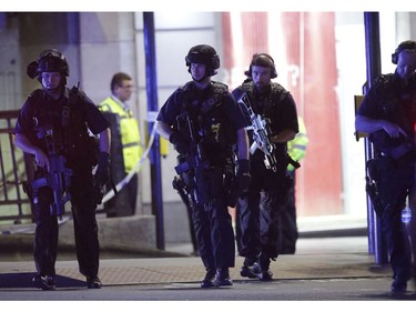 Armed police outside Monument station.