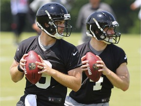 Austin Trainor, left, and Alek Torgersen perform a passing drill during Atlanta Falcons rookie camp on May 12 in Flowery Branch, Ga. Curtis Compton/Atlanta Journal-Constitution