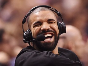 Rapper Drake has a laugh during first half NBA basketball action between the Golden State Warriors and Toronto Raptors in Toronto on Wednesday, November 16, 2016. THE CANADIAN PRESS/Frank Gunn ORG XMIT: FNG512
Frank Gunn,