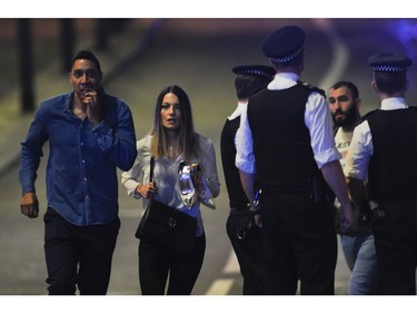 Members of the public leave the scene of a terror attack on London Bridge.